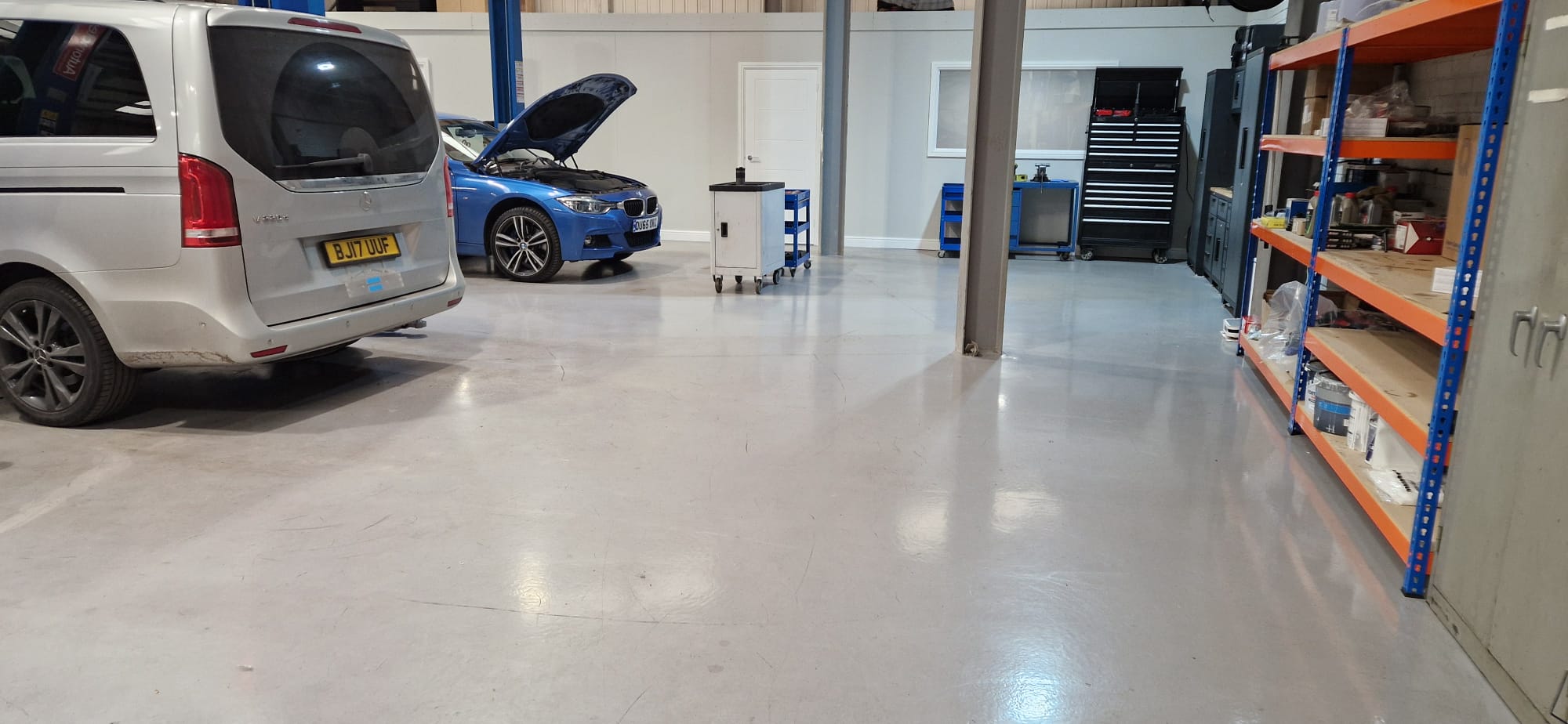 BMW and Mercedes in workshop